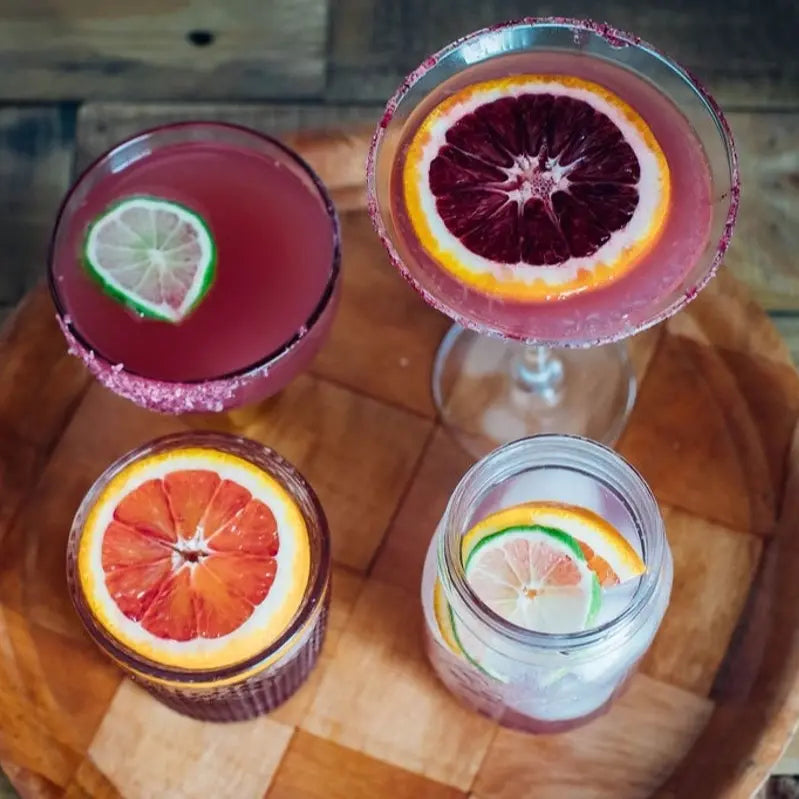Birds-eye view of 4 different cocktails